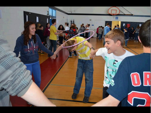 students playing with hula hoops